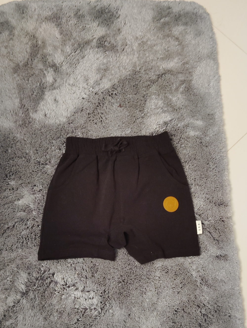 Huxbaby Black Kids Shorts with Mustard Patch